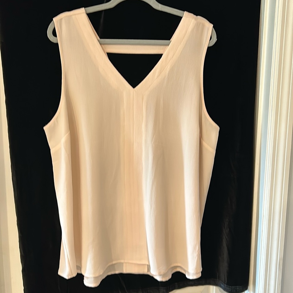 Sleeveless pink blouse